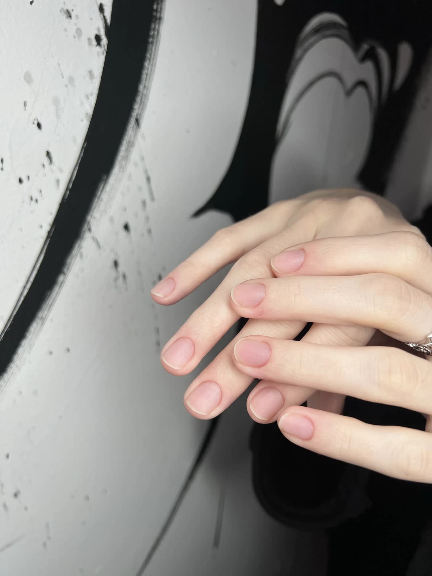 The same hands before the set: short, natural nails